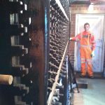 James Coulston holding the first full length locking bar to be fitted to all 30 locking racks. 06th April 2014