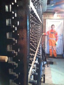 James Coulston holding the first full length locking bar to be fitted to all 30 locking racks. 06th April 2014