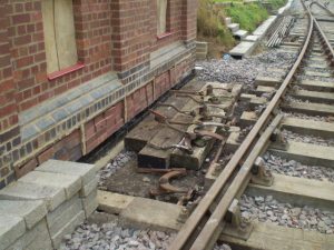 2009, the initial laying out of the external crank bench. Note only the concrete foundation castings are in place, the hardwood timber was purchased & installed later. The cranks shown have been refurbished & repainted prior to final installation.