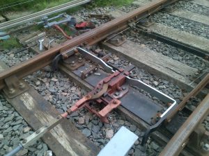 Facing point lock, in the locked position after the locking bar had its notches cut.