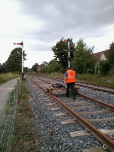 Graham Peacock pushing a permanent way trolley