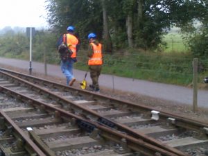 Two investigators measure the distances to key markers at Boughton