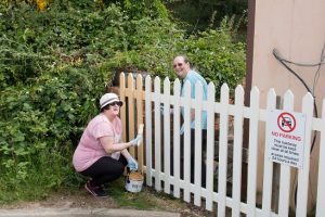 Painting the station fence on the 17th of June 2015. Photo: John Bannister