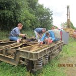 The first cleaned up B5 bogie is repainted using black chlorinated rubber paint, by Nationwide Building Society volunteers on 29th July 2015. Photo: Grahame Every