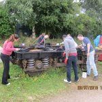 The first cleaned up B5 bogie is repainted using black chlorinated rubber paint, by Nationwide Building Society volunteers on 29th July 2015. Photo: Grahame Every