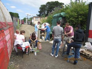 A group of Nationwide Building Society staff help the N&LR by sorting and cleaning track fishplate bolts on July 15 2015.