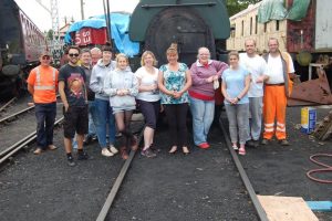 Nationwide Building Society staff and Volunteer Working Members Grahame Every, Paul Hirst and David Millard stand in front of Peckett 2105 on the 23rd of July 2015 Photo: Brian Chambers