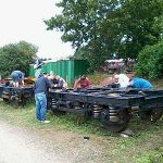 On 29th July 2015 Nationwide Building Society volunteers alongside Volunteer Working Members Grahame Every and David Millard, use quick drying chlorinated rubber paint on two BR B5 bogies that will be used under the BR Mark 2 coaches. Photo: David Millard