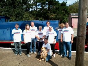 Nationwide Building Society volunteers posing in front of Ruston & Hornsby shunting locomotive 'Sir Giles Isham'. Photo: David Millard