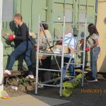 Nationwide Building Society volunteers Carol, Liz, Peta and John prepare the container doors for repainting. Photo: Grahame Every