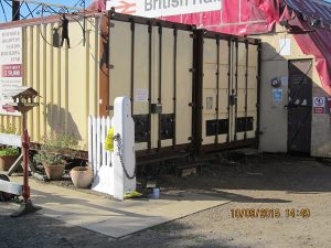 After the container door repainting. Paint colours used in the transformation are BS381C Biscuit and Mid Brown, along with recently donated black Aldi Metalcare paint. Photo: Grahame Every