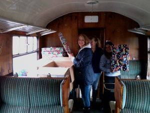 The ladies of the group chose to help Santa by checking the wrapping paper on the presents for the Santa's Special Trains. Note Santa has given special permission for this photo to be shown, no others were allowed as he wants to keep the presents a surprise. Photo: D.Millard