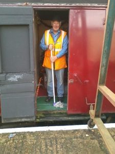 Volunteer Co-ordinator Grahame Every does as Santa has asked and mops the floor of the Grotto