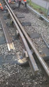 View of a completed running line point check rail on the running/main line side of the point. New CCL chair nearest, with new wooden keys to keep the rail firmly in place. Note the improved splayed end and compare against the old ones in step 2. We now have a decent check rail with no side wear on the head, with a more gradual lead in over the correct length, and properly seated in chairs and held firm. The lead in now has an initial flangeway gap of 3 ½ inches and the flangeway gap is now 1 ¾ inches along the parallel section and opposite the crossing nose on the point. It looks much better than the old one. Photo: Graham Peacock